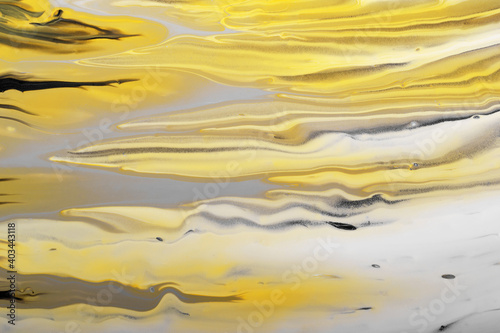 Trending colors of 2021. Gray, yellow and black waves flow. Marble effect background or texture. Fluid Art