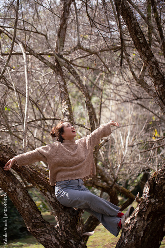 Portrait of Asian young woman enjoying plum blossom garden in the spring.