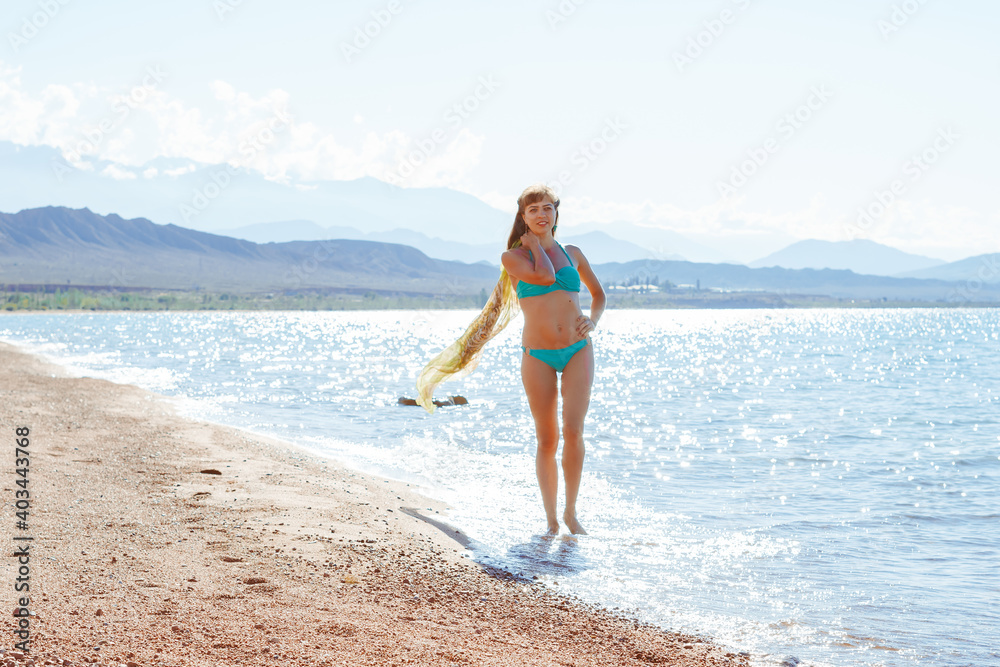 girl with pareo by the sea girl with pareo by the sea