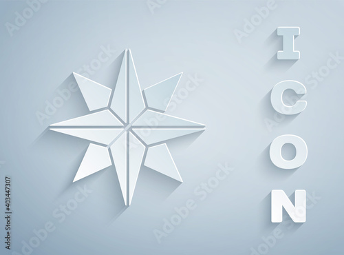Paper cut Wind rose icon isolated on grey background. Compass icon for travel. Navigation design. Paper art style. Vector Illustration.