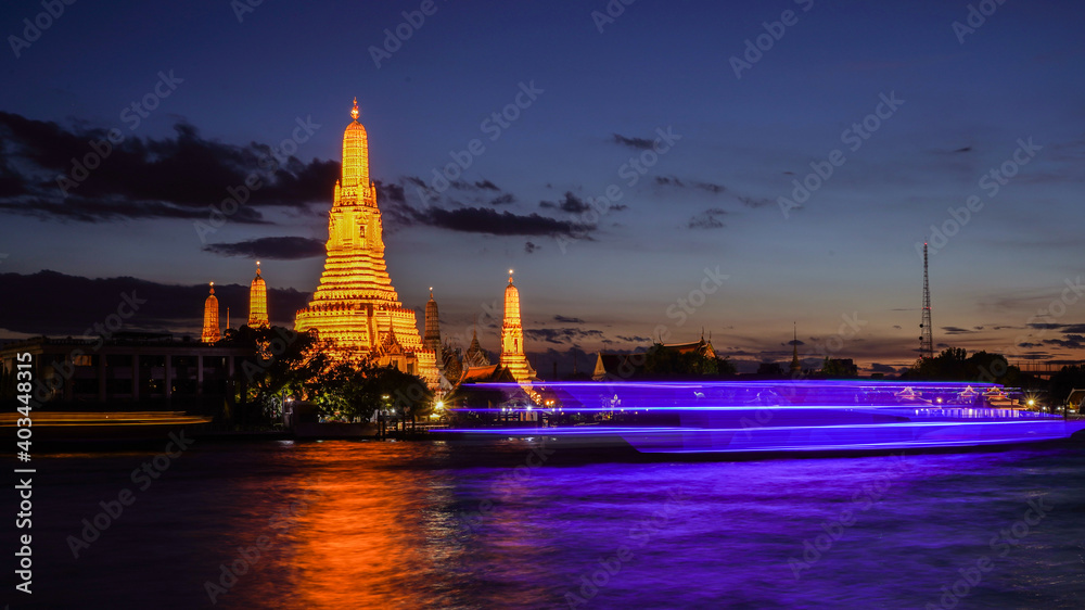 Night view of Wat Arun Buddhist temple famous landmark and tourist destination in Bangkok, Thailand 