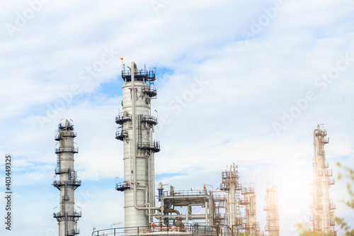 Industrial of oil refinery plant from industry zone ,Refinery factory oil storage tank and pipeline steel with blue sky.