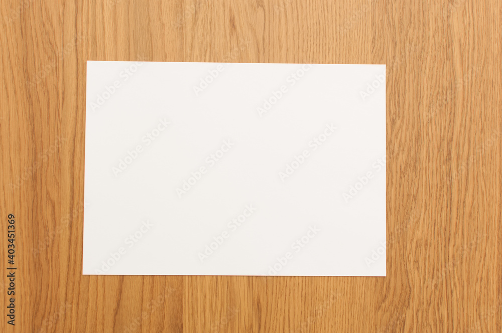 White template paper on wood texture White template paper on wood texture