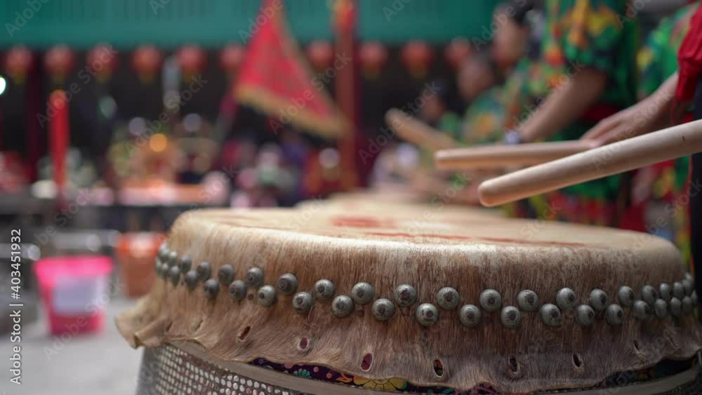 People drumming the Chinese drums to celebrate Lunar New Year