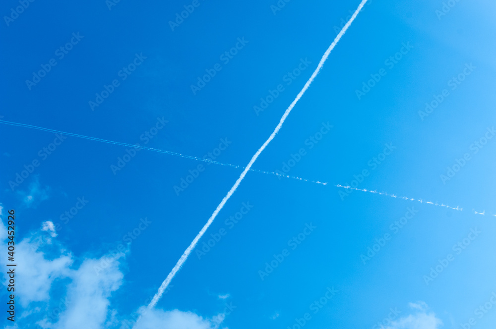 Contrails - vapors of airplanes left in the clear sky