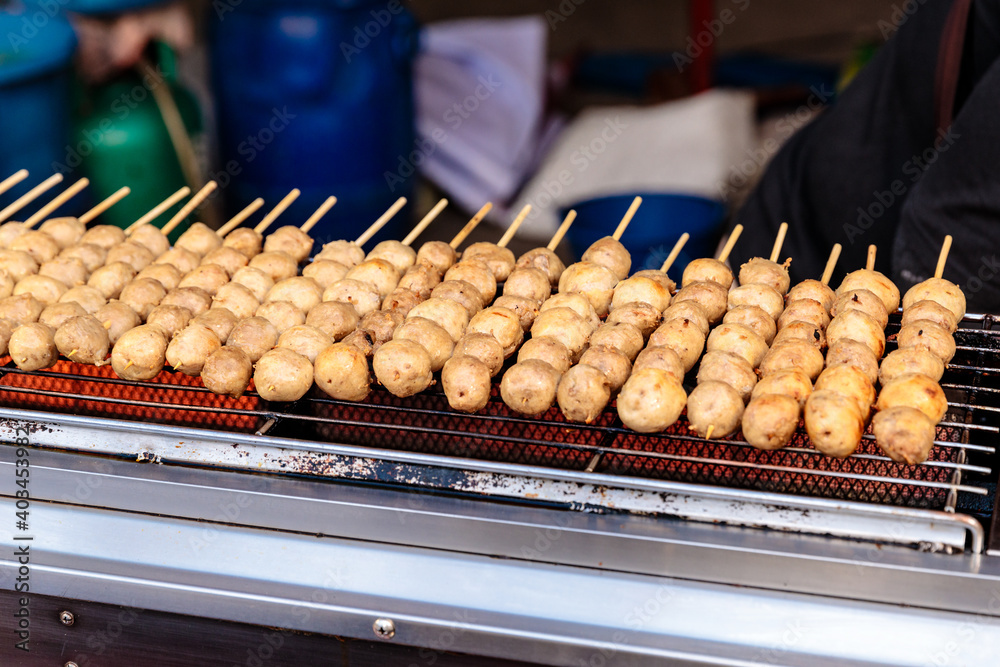 Grilled Meatballs on stove at market, Thailand street food Grilled Meatballs on stove at market, Thailand street food