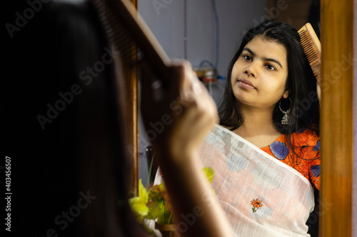 indian woman in front of mirror