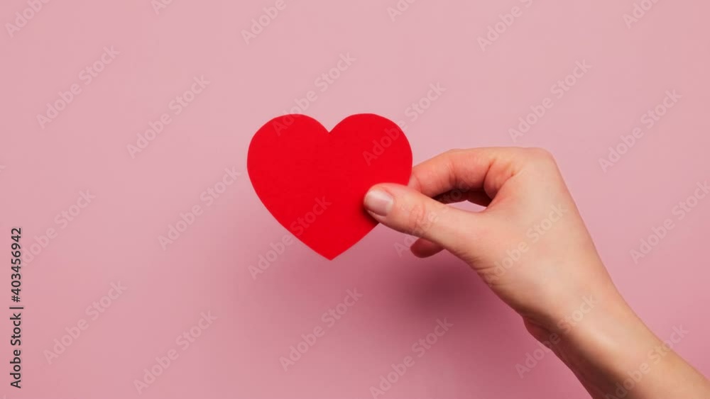 Hands open craft envelope letter with a valentine red heart for the holiday valentine's day. Declaration of love, relationship concept. Hands open craft envelope letter with a valentine red heart for the holiday valentine's day. Declaration of love, relationship concept.
