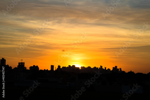 Photos of the sunset at the end of the day with the outline of the buildings in londrina, parana, brazil