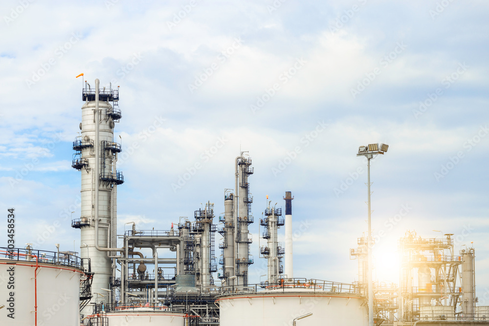 Industrial of oil refinery plant from industry zone ,Refinery factory oil storage tank and pipeline steel with blue sky. Industrial of oil refinery plant from industry zone ,Refinery factory oil storage tank and pipeline steel with blue sky.