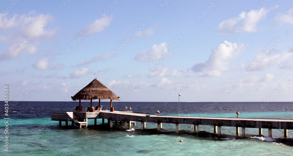 Berth for sea boats and yachts on the background of the sky landscape.