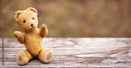 Toy vintage retro bear giving hands, hope and love concept, web banner