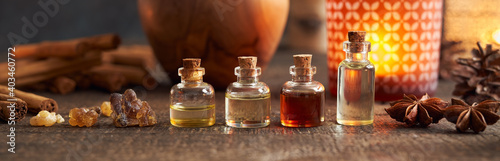 Panoramic header of essential oil bottle with frankincense and Christmas spices - cinnamon and star anise