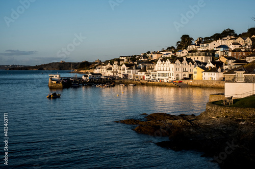 View along the seawall and facades of houses in Saint Mawes, Cornwall, UK. photo