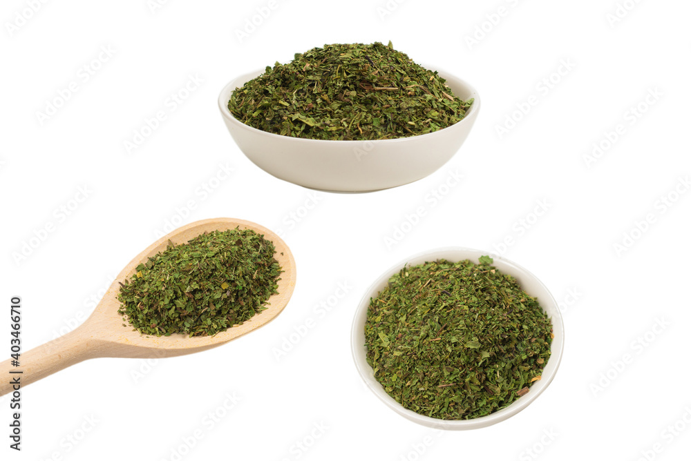 Dry mint in wooden spoon isolated on white. Dry mint in wooden spoon isolated on white.