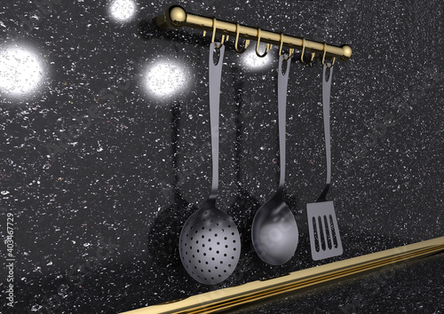 Kitchenware metal hooks with golden for hanging kitchenware utensils and tools. On a granite background