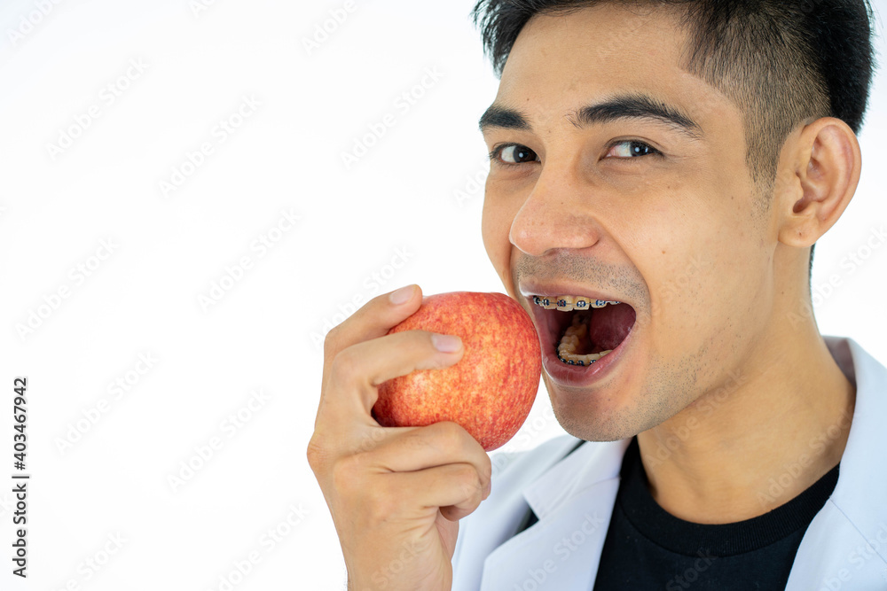 Asian medical doctor dentist with baraces on white background cope space. healthcare and medicine concept. Asian medical doctor dentist with baraces on white background cope space. healthcare and medicine concept.