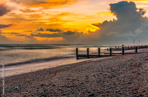 A composite  long exposure view along the beach at Worthing  Sussex just before sunset