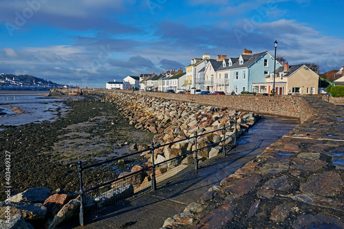 Houses in a row with sea defences in the small town of Instow in North Devon