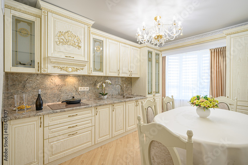 Luxury modern neoclassic beige kitchen interior photo