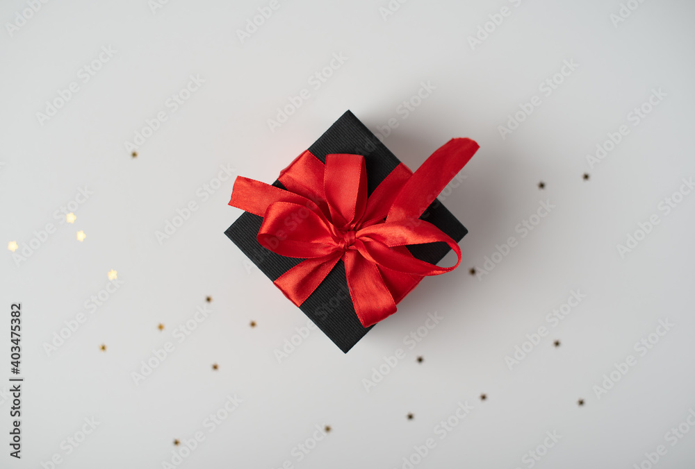 Black gift boxes with red ribbon on white background. The Concept Of Valentine's Day. Black gift boxes with red ribbon on white background. The Concept Of Valentine's Day.