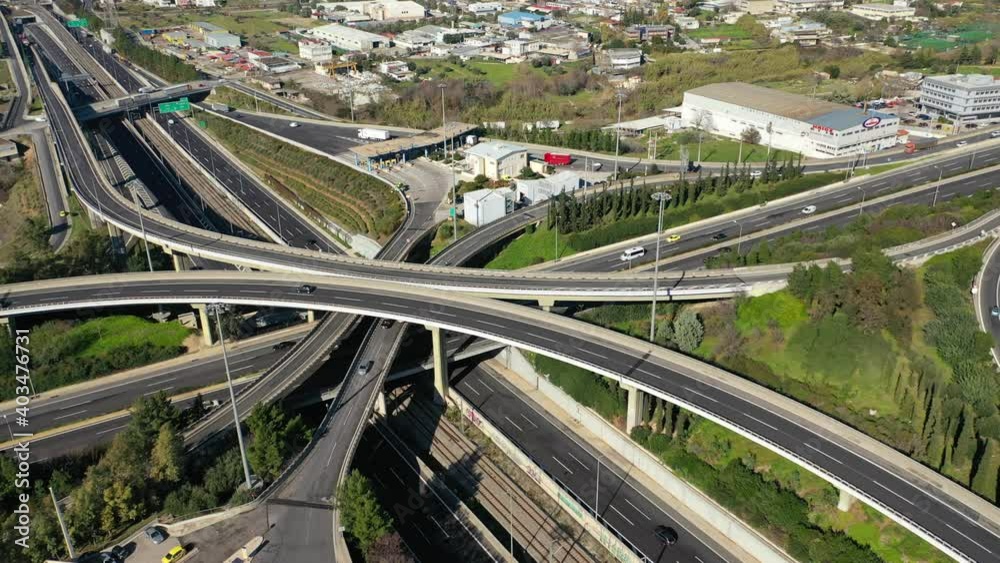 Aerial drone time-lapse video of motorway multilevel junction crossing through national road during rush hour Aerial drone time-lapse video of motorway multilevel junction crossing through national road during rush hour