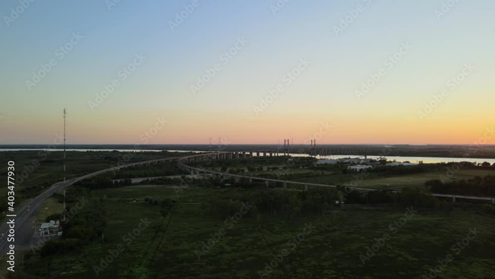 Aerial dolly right of Zarate Brazo Largo bridge on the distance at sunset Aerial dolly right of Zarate Brazo Largo bridge on the distance at sunset