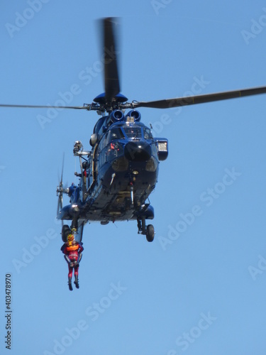 Fototapeta Naklejka Na Ścianę i Meble -  Helicopter Super Puma during rescue training operation with rope