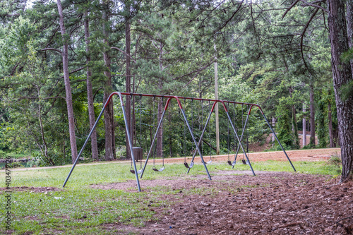 Old worn swing set in the park