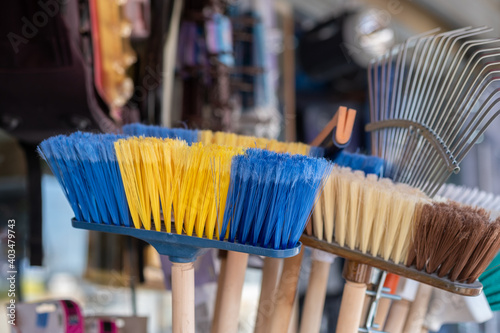 Colorful brooms and other homeware sold at the local market