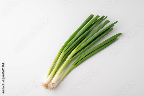 isolated bunch of scallion on white background photo