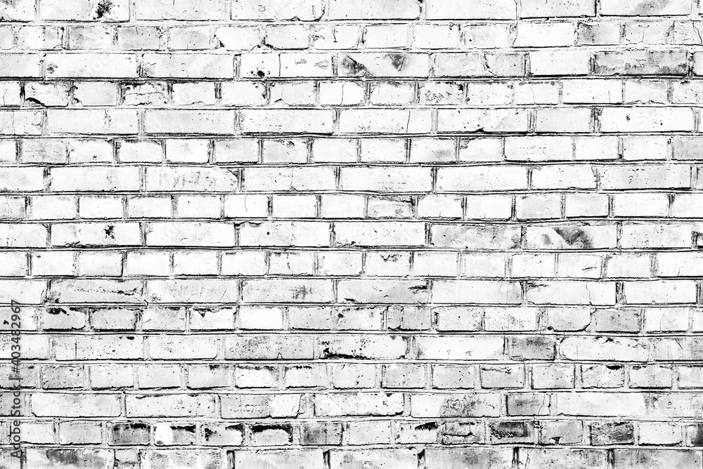 Texture of a brick wall with cracks and scratches which can be used as a background Texture of a brick wall with cracks and scratches which can be used as a background
