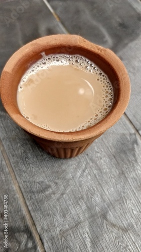 A kulhar or kulhad cup  traditional handle-less clay cup  from North India filled with hot Indian tea