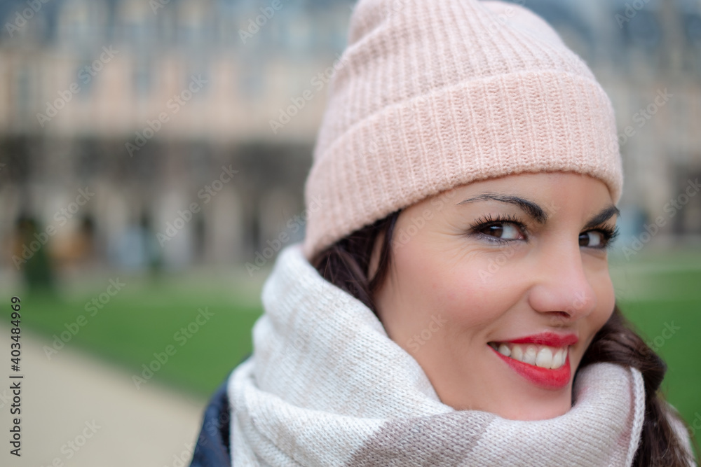 Happy cheerful young woman wearing her brown hair looking at camera with joyful and charming smile. Happy cheerful young woman wearing her brown hair looking at camera with joyful and charming smile.