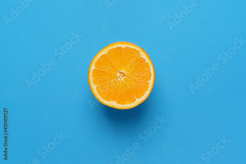 orange on blue background. top view copy space