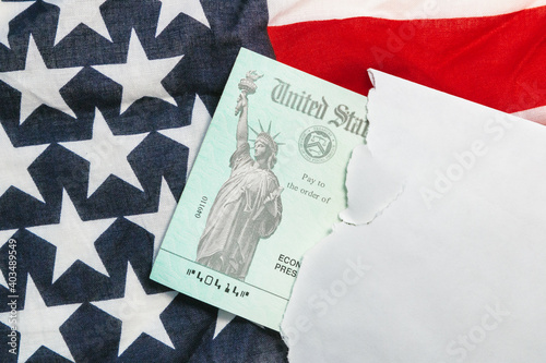 Second round Senate approved of US economic stimulus checks with an American flag during the COVID coronavirus pandemic