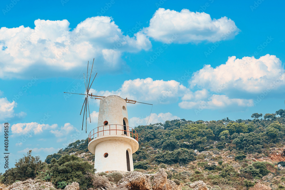 Traditional windmill in the mountains of the Greek island of Crete Traditional windmill in the mountains of the Greek island of Crete