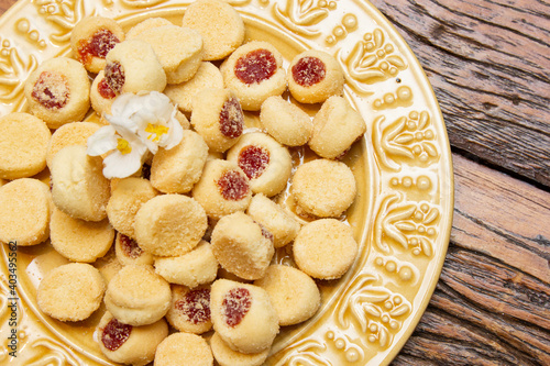 Traditional Brazilian guava paste cookies called goiabinha on wooden table.