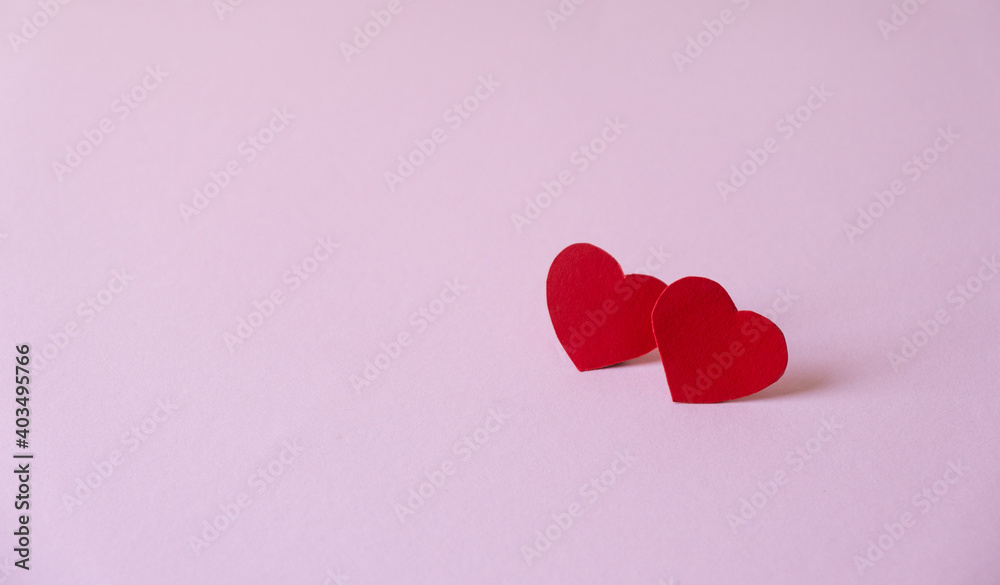 Two hearts on a pink background