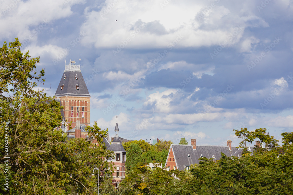 Obraz premium cloudy sky over the church in the city, Amsterdam, europe, church of st. john baptist
