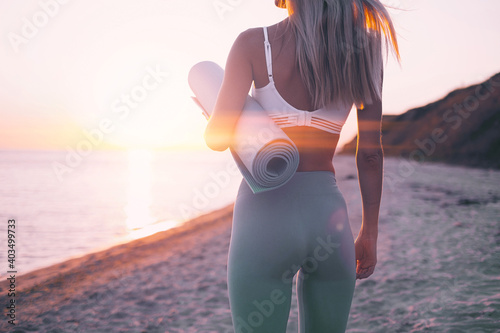 woman is engaged in sports exercise on the beach