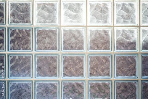 Closeup shot of square glass windows with light in the background