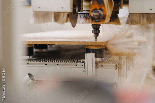 Selective focus shot of chipboard milling machine