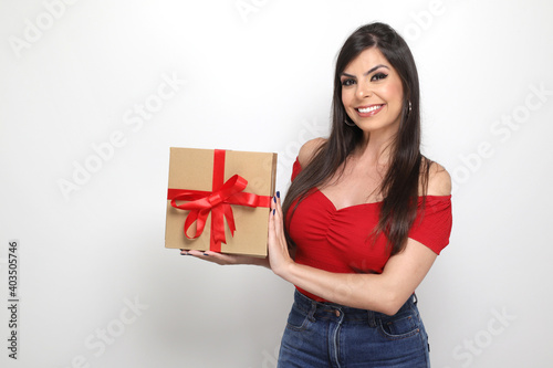beautiful girl holding valentine's gift on white background