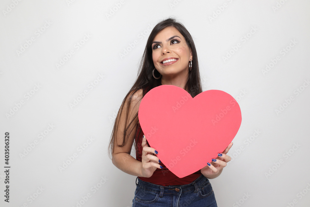 beautiful girl holding valentine's gift on white background beautiful girl holding valentine's gift on white background