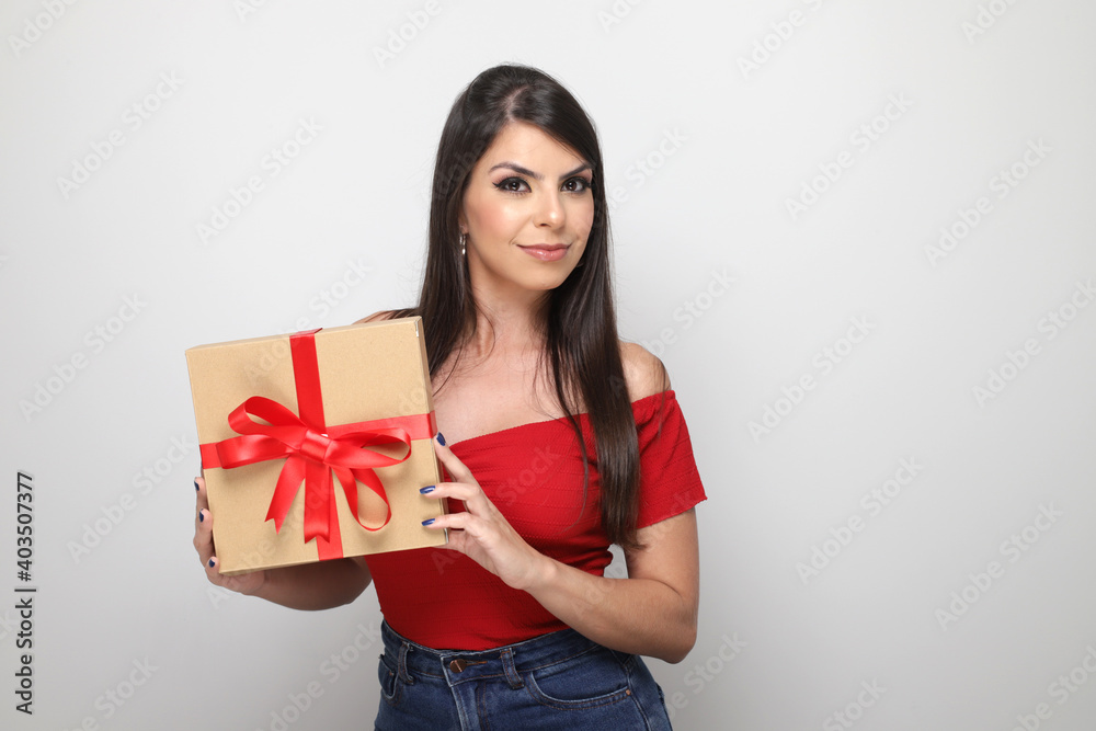 beautiful girl holding valentine's gift on white background beautiful girl holding valentine's gift on white background