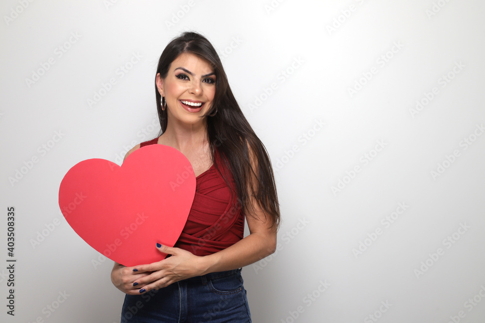 beautiful girl holding valentine's gift on white background beautiful girl holding valentine's gift on white background