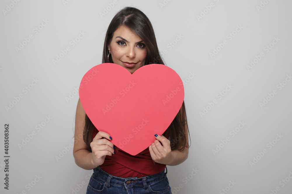 beautiful girl holding valentine's gift on white background beautiful girl holding valentine's gift on white background