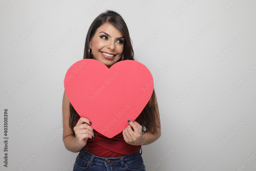 beautiful girl holding valentine's gift on white background beautiful girl holding valentine's gift on white background