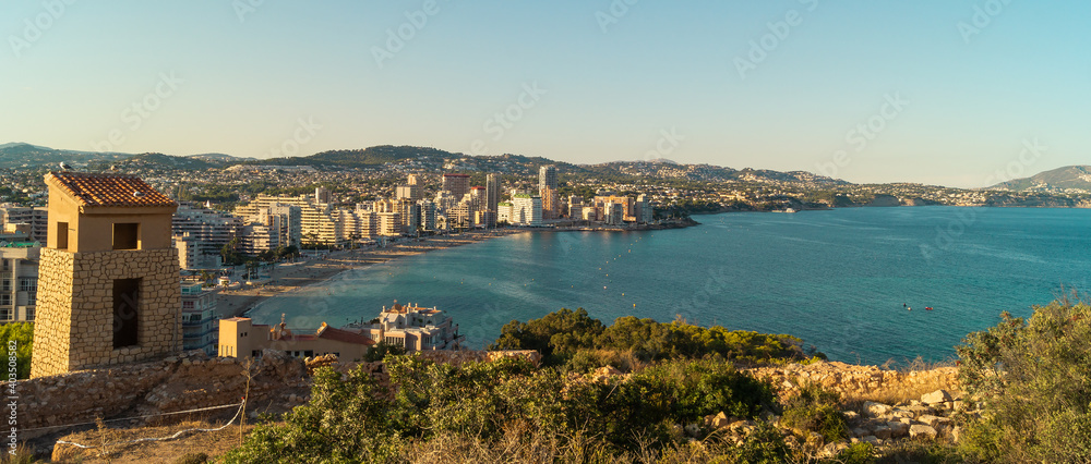 Urban skyline of the city of Calpe that stands out for its buildings facing the beach and the turquoise color of the Mediterranean Sea (Alicante, Spain).